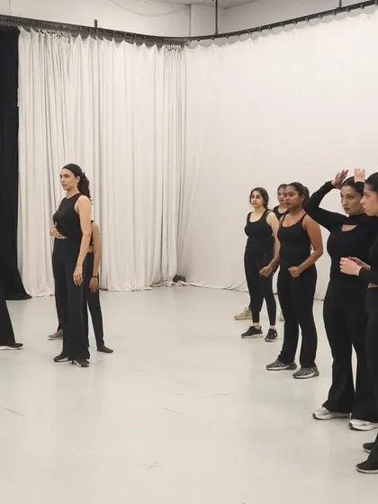 This is where the magic begins. I am guiding a group through a new piece of choreography. My process is all about breaking down the steps and focusing on expression, ensuring everyone feels confident and ready for the performance.