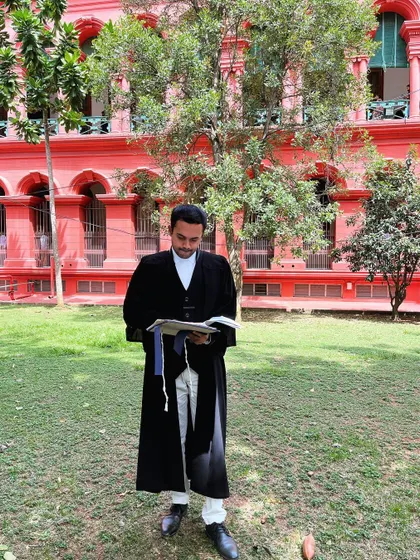 Reviewing case notes outside the courthouse. Preparation is key, and I often spend quiet moments before a hearing to ensure every detail is fresh in my mind.