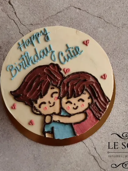 This adorable couple cake was made with a special low-sugar honey buttercream. The half-kg Lemon Cream Cheese cake features a simple, sweet drawing of a couple hugging.