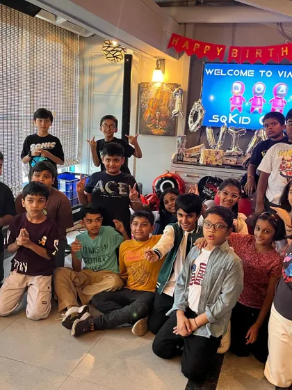 The entire SQKID GAME crew posing for a group photo. What an unforgettable 10th birthday bash!