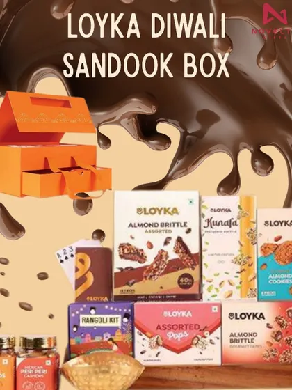 The Loyka Diwali Sandook Box is a grand gesture. This multi-drawer box is packed with an extensive assortment of chocolates, cookies, a rangoli kit, and more.