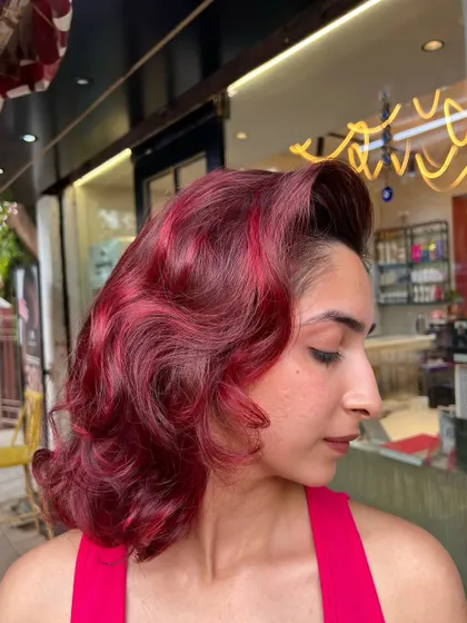A stunning red hair makeover with a vintage-inspired wave style. This look is pure Hollywood glamour, showcasing a rich, even red tone.