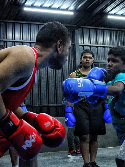 A close-up of a youth sparring match. I teach them to look their opponent in the eye and stand their ground. This is how you build confidence.