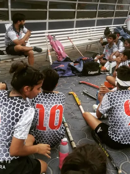 A team talk during a break. I ensure my coaches provide tactical feedback and encouragement to keep the players focused and motivated throughout the game.