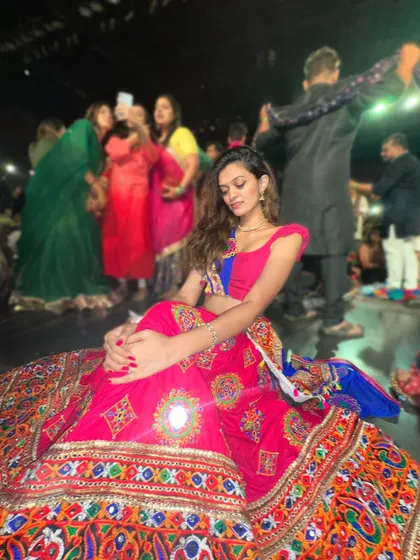 A quiet moment amidst the energy of a Garba night. I teach all the popular folk steps so you can dance with confidence and enjoy the celebration.