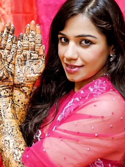 Another happy bride posing with her full bridal mehandi. The dark stain is already starting to develop.
