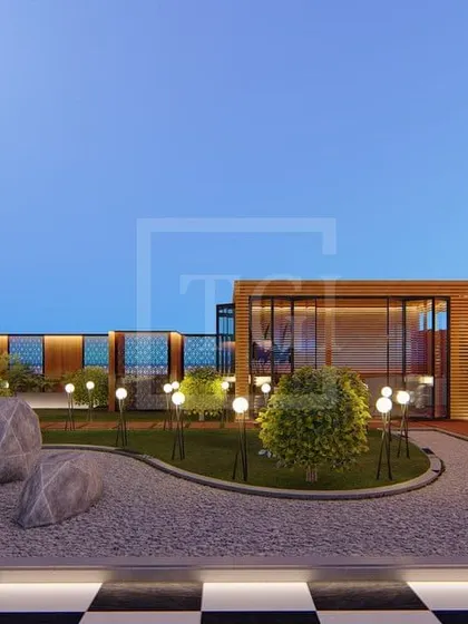 A zen garden concept for the Gurgaon project, featuring a gravel area with large rocks, surrounded by manicured bushes and a checkered floor.