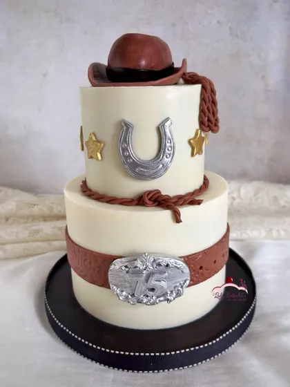 Another view of the cowboy cake, showing the detailed belt and buckle.