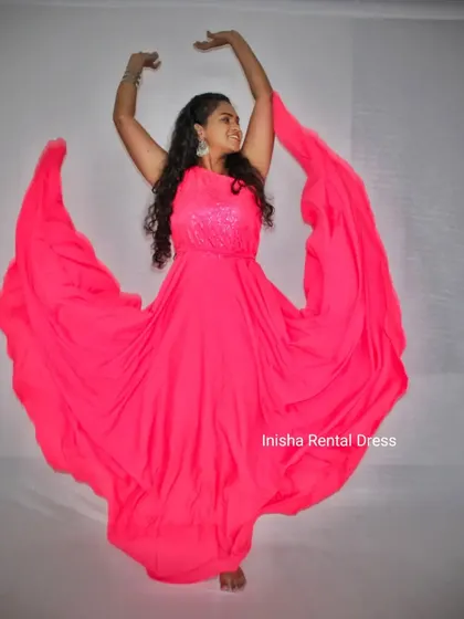 The flowing fabric of the hot pink infinity gown is perfect for creating beautiful, dynamic shapes in your photos.