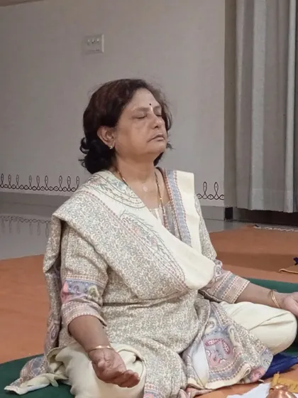 A participant in a state of deep meditation during the Bhuta Shuddhi practice, allowing the process to work on her system.