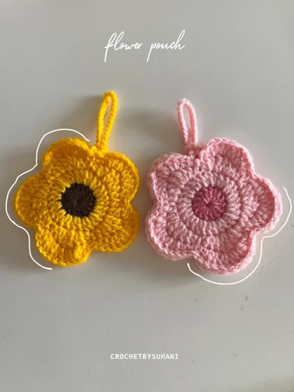 My little flower pouches are perfect for keeping small treasures safe. This side-by-side shot shows the sunflower and pink daisy designs. They are great for holding jewelry, lip balm, or even your AirPods.