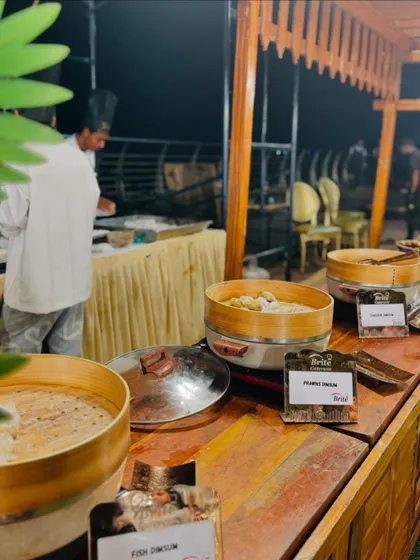 The dim sum station, showing multiple steamers and a variety of choices including fish and prawn.