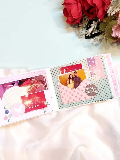 This page has a cute envelope that can hold tiny photos or messages.