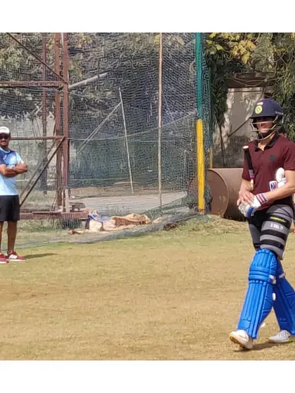 Shubman Gill walking off after a solid net session, with one of our coaches in the background. We provide a professional and supportive environment for players at all levels.