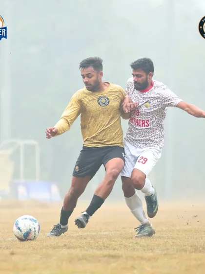 A physical battle for possession, showing the strength and determination required to win midfield duels.