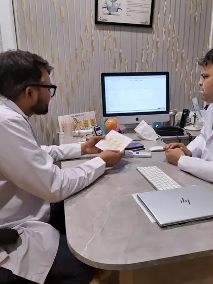 Here is my colleague, Dr. Manish Jangra, during a consultation. We believe in a collaborative approach to patient care.
