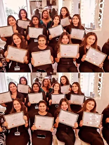 The full class of graduates, all dressed in black, holding their hard-earned certificates. This picture represents their commitment and the start of their new careers.