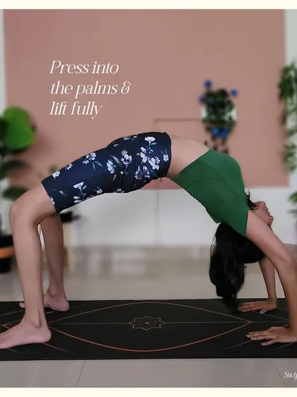 Step 5 for Upward Bow Pose: Press firmly into your palms and feet to lift fully, straightening the arms as much as possible.