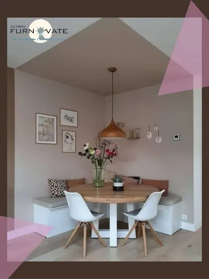 A charming dining nook with built-in bench seating, a round wooden table, and modern white chairs. This setup is a great space-saving solution for smaller homes.
