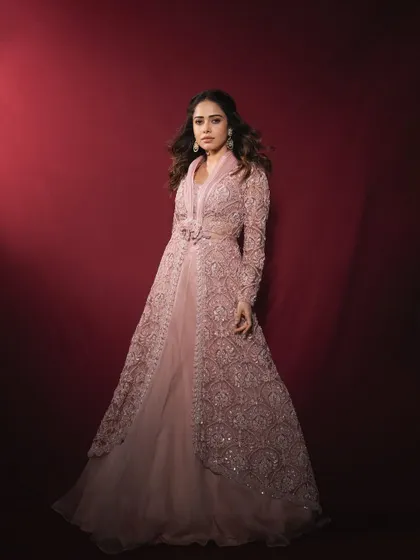 The full silhouette of this flowing pastel lehenga and jacket ensemble. It’s a modern take on wedding wear that is both elegant and easy to move in.
