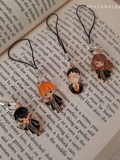 A different angle of my Harry Potter phone charms, showing the trio of Harry, Ron, and Hermione ready to be attached to your phone or bag.