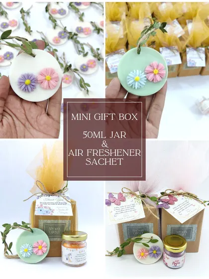 Another view of the mini gift box, showcasing the beautiful combination of a jar candle and a floral wax sachet for a memorable baby shower gift.