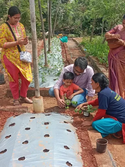 A father and son planting strawberry saplings together during our plantation event. These are the precious memories that are cultivated in a garden.