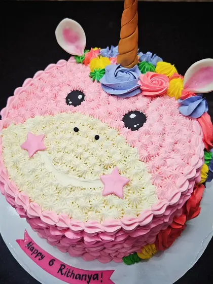 Another Unicorn! A cute, pink unicorn face cake for Rithanya's 6th birthday, piped entirely with buttercream.