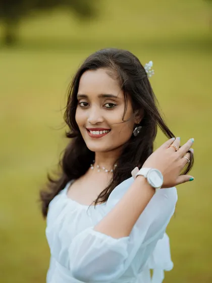 A beautiful, happy portrait of the bride-to-be during her outdoor pre-wedding shoot. Her natural smile and the soft lighting make for a perfect candid portrait.