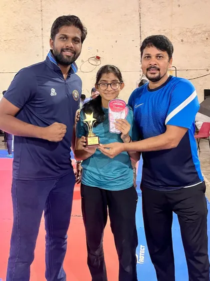 Our coaches with 'Star Boxer' Siddhi Shah. We provide continuous mentorship to guide our young athletes through their competitive journey.