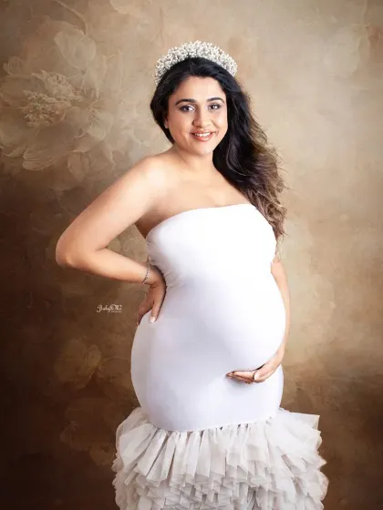 Feeling like royalty, as every mama should. This beautiful portrait showcases the elegant white gown and a crown from my studio's prop collection for that extra special touch.