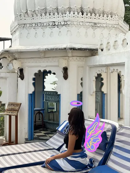 An angelic vibe for this beautiful white palace in Udaipur, complete with a halo and wings.