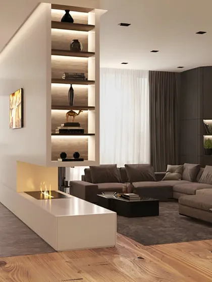 This design uses a half-wall with a built-in fireplace and shelving to divide a large room. It creates a cozy living area while maintaining an open and connected feel.