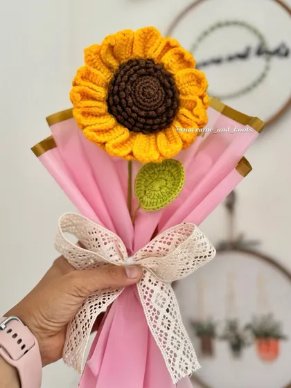 This single large crochet sunflower makes a statement. It's beautifully wrapped and tied with a lace ribbon, creating a thoughtful and impressive gift for someone you love.