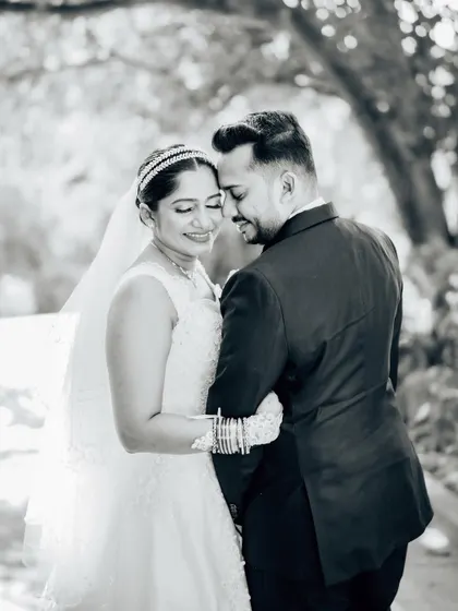 A soft and romantic black and white portrait of the couple. The monochrome tones emphasize their emotional connection and the beautiful natural light.