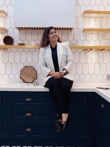 The kitchen is the heart of the home, and I love making it both beautiful and functional. Here I am in a recently completed kitchen featuring a trendy dual-tone design with classic white and bold navy blue, complemented by a patterned floor and smart storage. It’s a space designed for cooking, conversation, and creating memories.