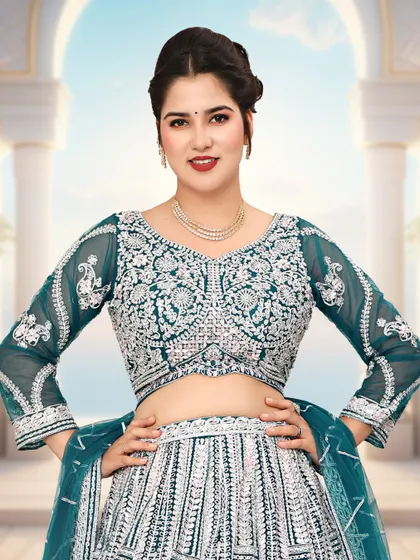 A closer look at the intricate silver detailing on the blouse of the bottle green lehenga.