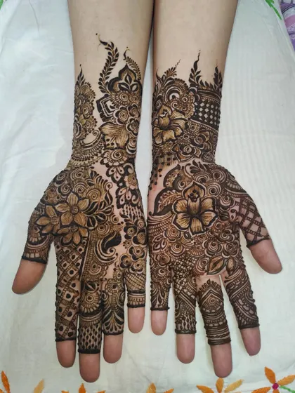 A full-coverage design with a mix of shaded flowers and delicate line work, creating a balanced and beautiful look.