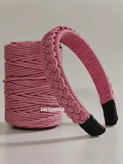 The baby pink macrame hairband next to its spool of cord. It’s amazing to see how simple materials can be transformed into something so pretty.