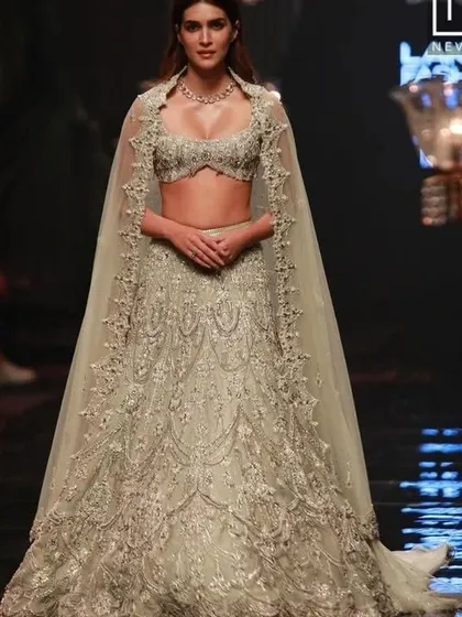 Kriti Sanon looks ethereal in this heavily embroidered lehenga with a cape. I can draw inspiration from this to create a fairytale-like ensemble for your big day.