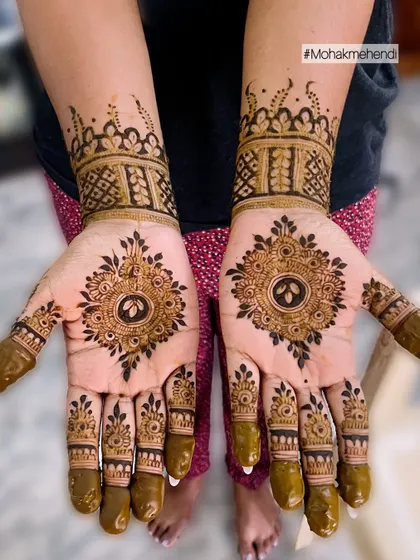 A gorgeous design for a wedding guest or a special occasion. This piece features a central mandala on the palm with detailed finger designs and a cuff-style pattern on the wrist.