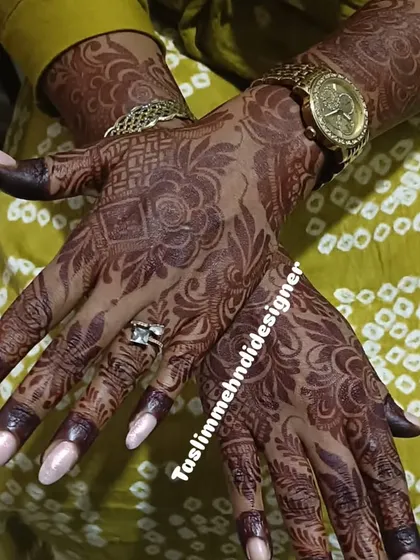 The rich, dark stain of this floral mehndi shows the quality of the natural henna I use. The design is a mix of bold flowers and delicate patterns, shown here after the paste has been removed.
