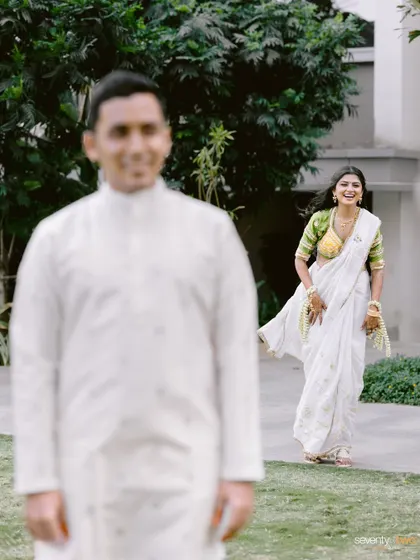 The bride's joyful reaction as she runs towards her groom for their first look. A moment of pure anticipation and happiness.