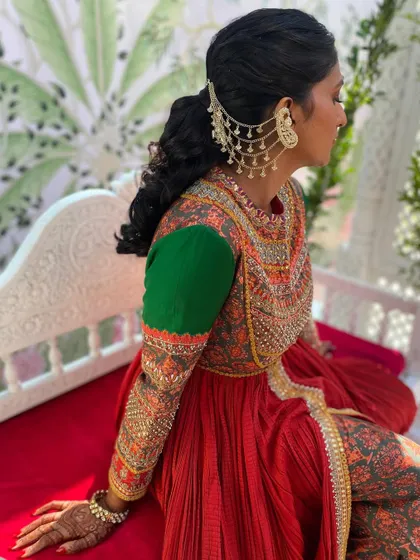 A side view of the textured ponytail, showing how the unique earring accessory connects to the hair, creating a seamless and stylish look.