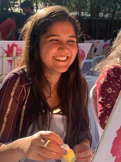 The pure joy on a guest's face during a paint workshop. Our goal is to make art accessible and fun for everyone, regardless of experience.