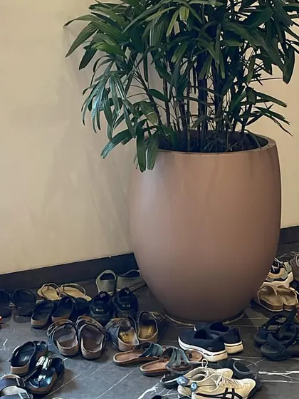 A pile of shoes outside our workshop space. This simple image is a beautiful symbol of a community coming together to leave their worldly concerns at the door and step onto the mat.