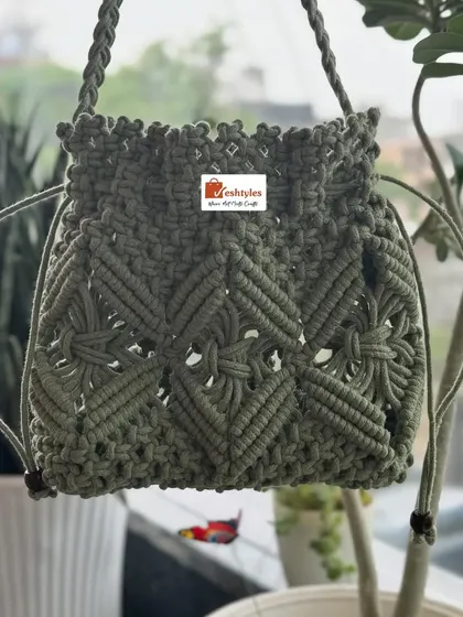 Another shot of the olive green potli bag, showing its beautiful shape and drawstring closure.