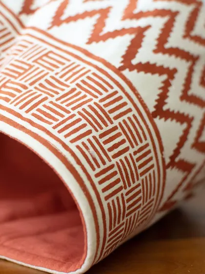 Form truly meets function in these multipurpose baskets. The rich, earthy color and geometric print make them a stylish addition, whether used for plants or storage.