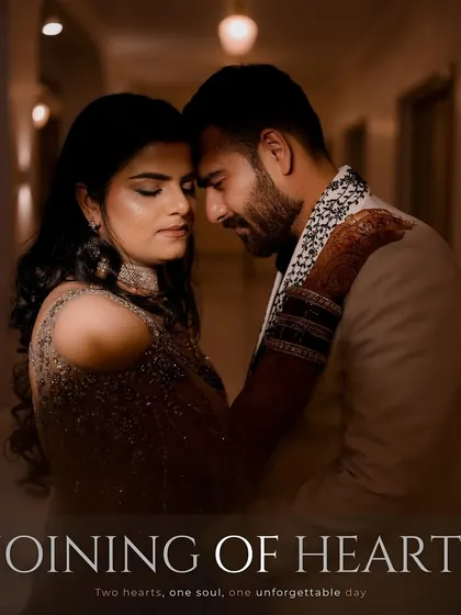 An intimate moment captured away from the crowds. We used the soft, ambient light of the corridor to create this romantic portrait, focusing on the couple's quiet connection and the beautiful details of their wedding attire.
