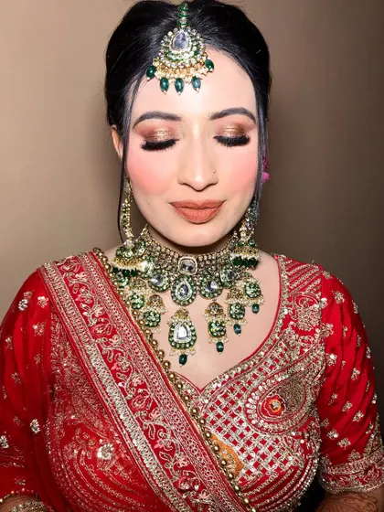 Eyes closed, showcasing the beautiful blend of eyeshadows and the perfect winged liner.